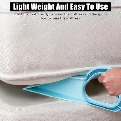 Close-up of the blue TuckEase tool inserted between a mattress and base